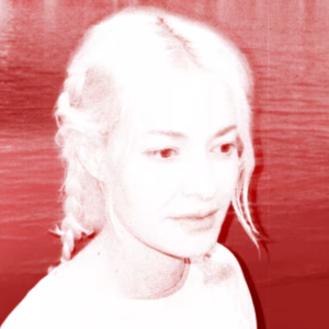 Red-tinted portrait of a young woman with light hair braided over her shoulder, looking to the right with a neutral expression.