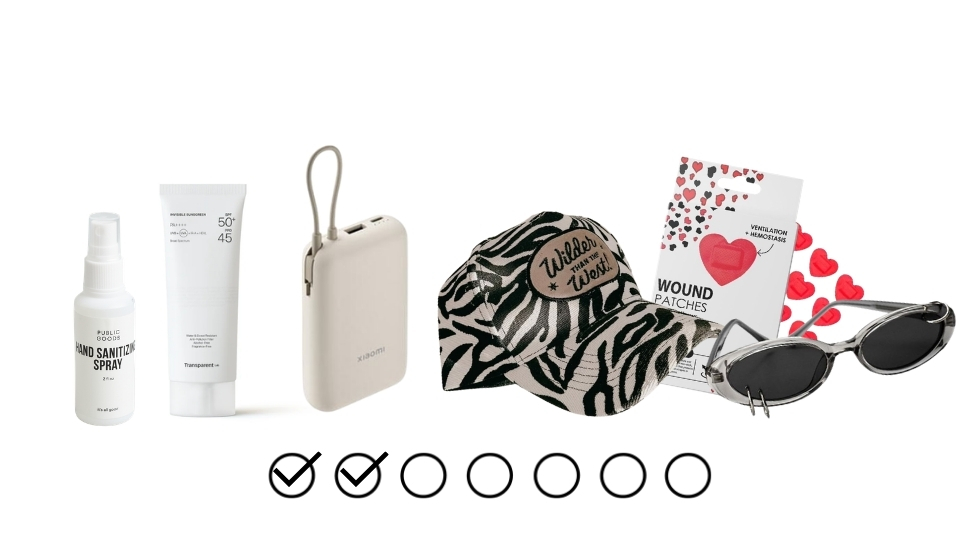 A row of travel essentials: hand sanitizer spray, sunscreen, a small beige tracker device, a zebra‑print cap, wound patches, heart-themed cards, and sunglasses with a heart motif.